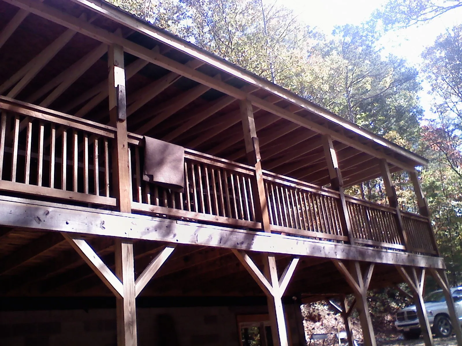 Timber framing under a new elevated porch and deck — Roof Leak Repair in Center by Roofing Brothers
